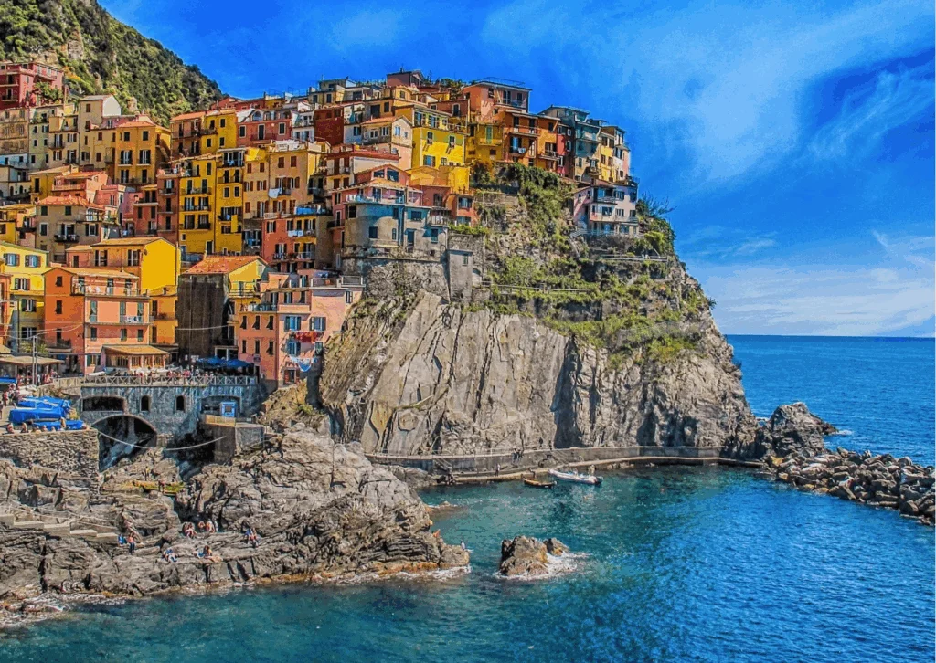 Image shows a coastal town in Italy, where you can buy a house in Europe easily.